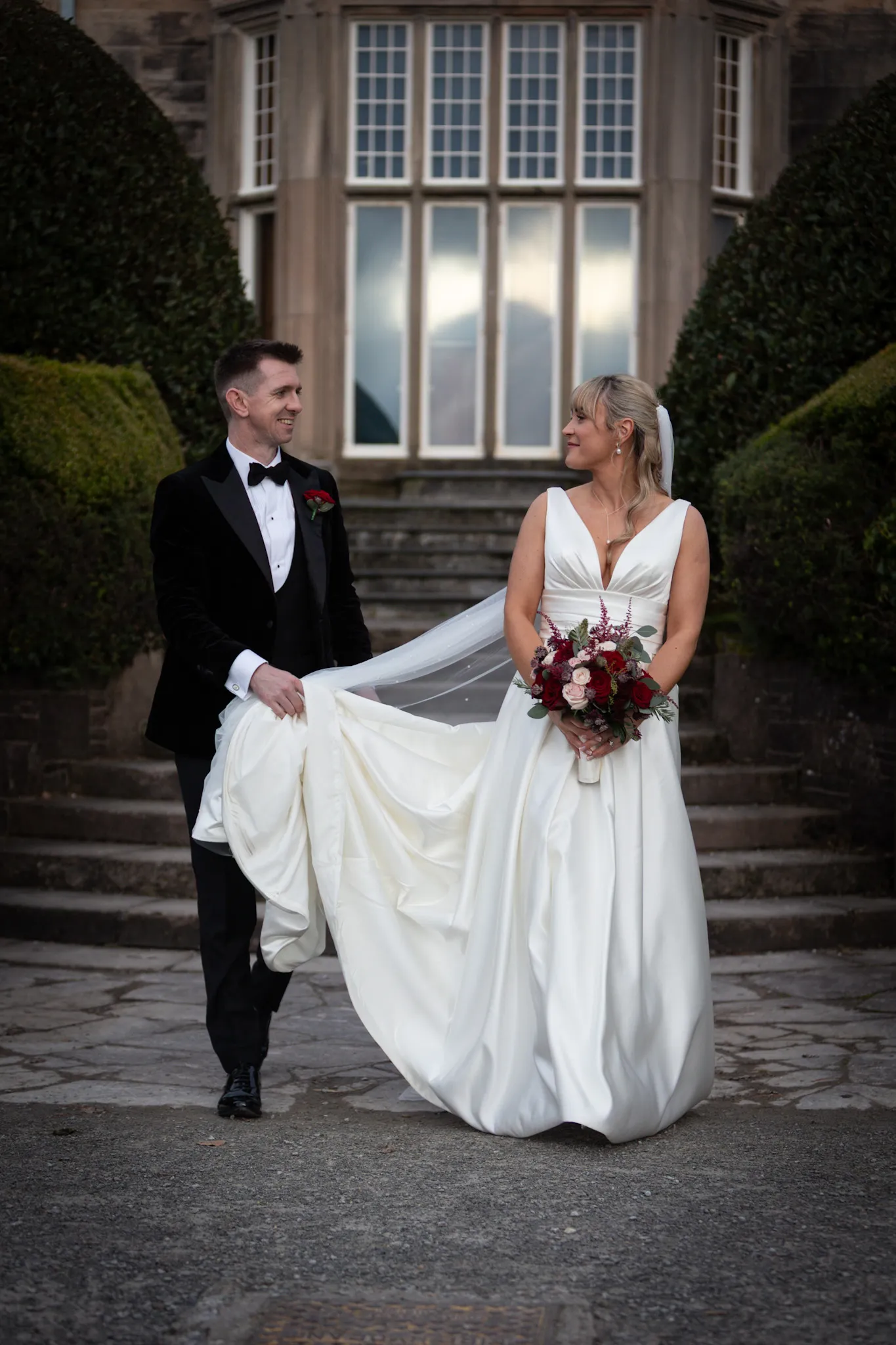 A Bride and Groom smiling after the wedding