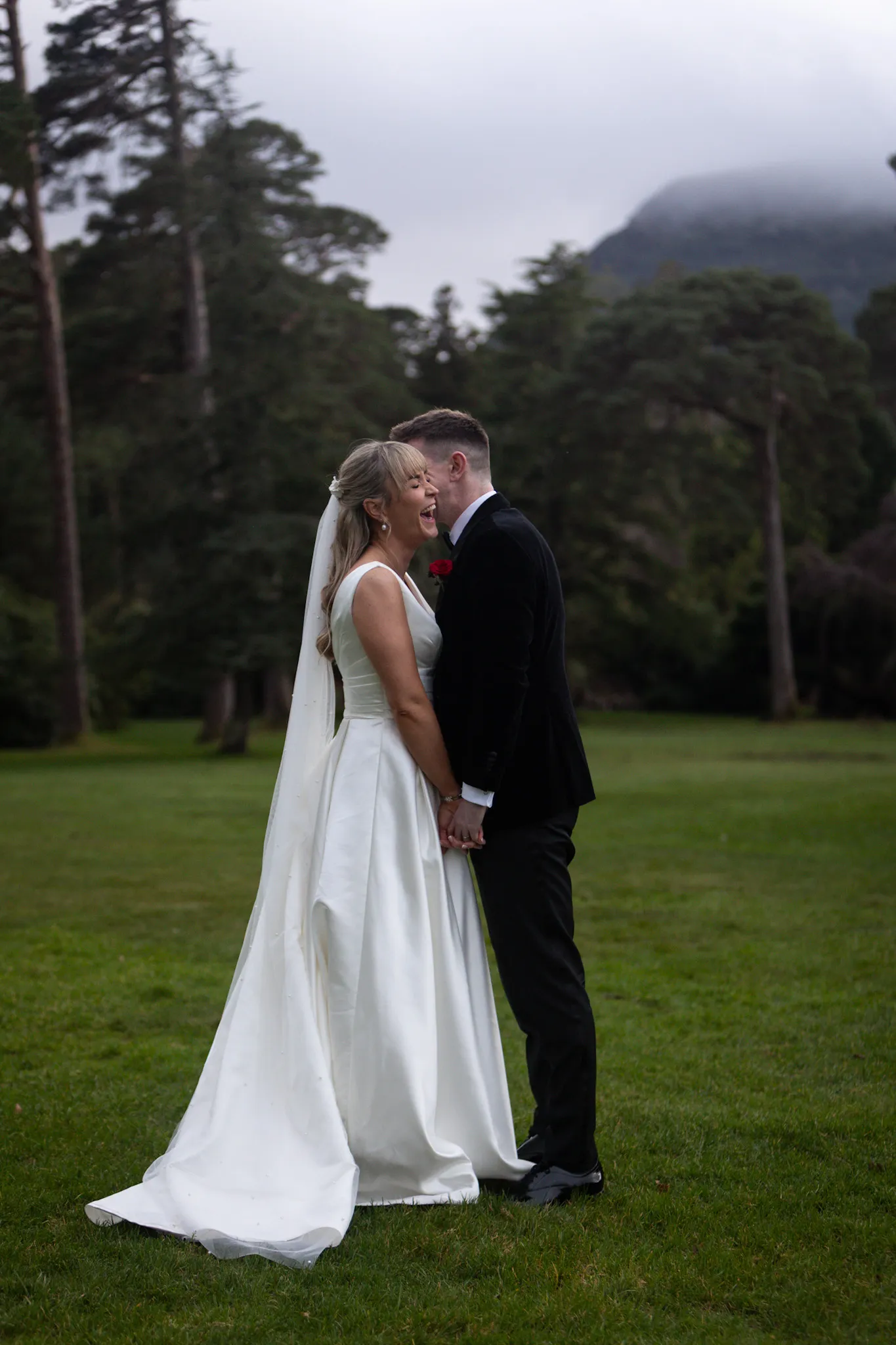 Bride and Groom embracing in a scenic location