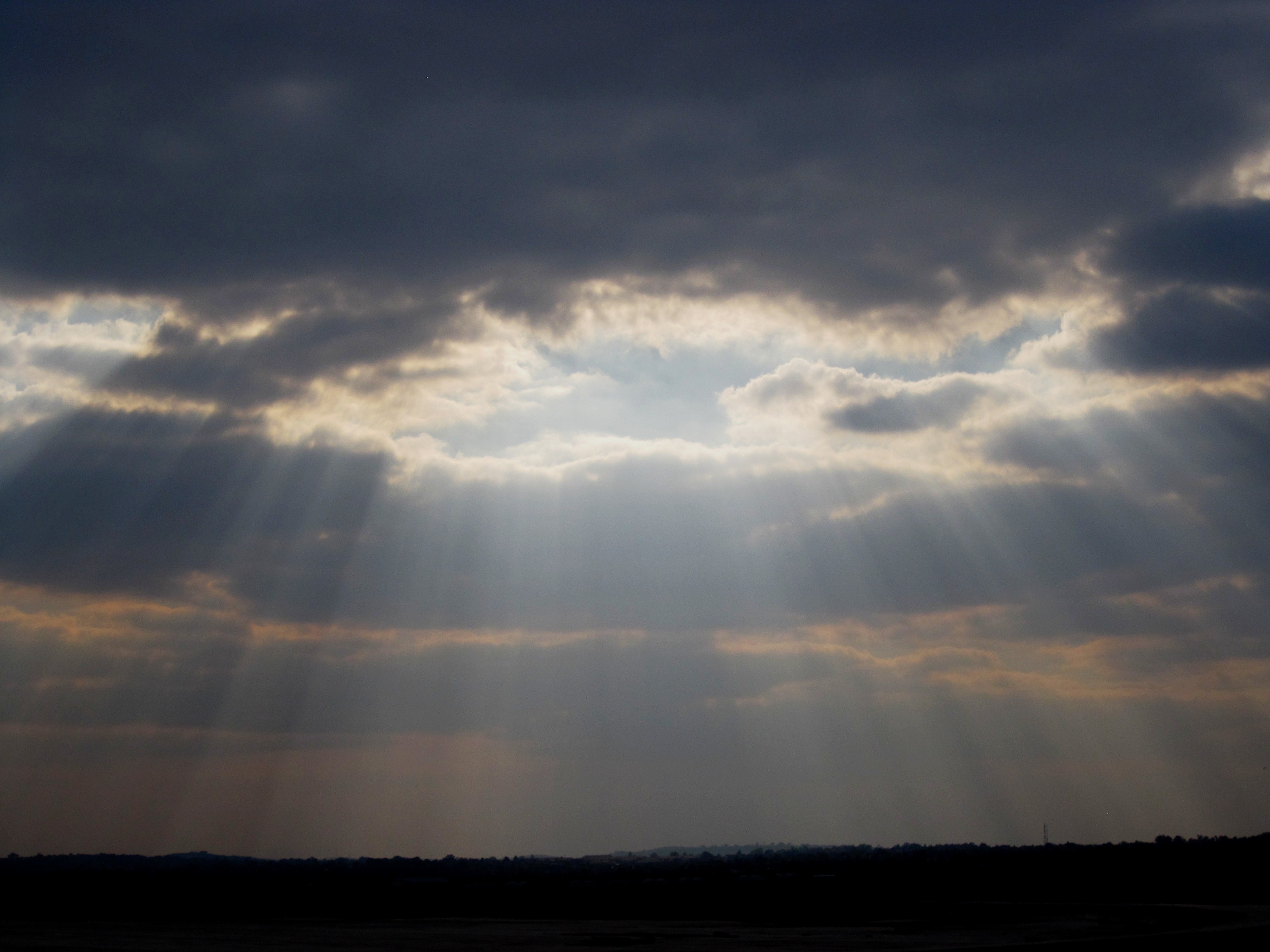 A winding staircase reaching into the clouds, symbolizing faith and taking the first step toward the unknown