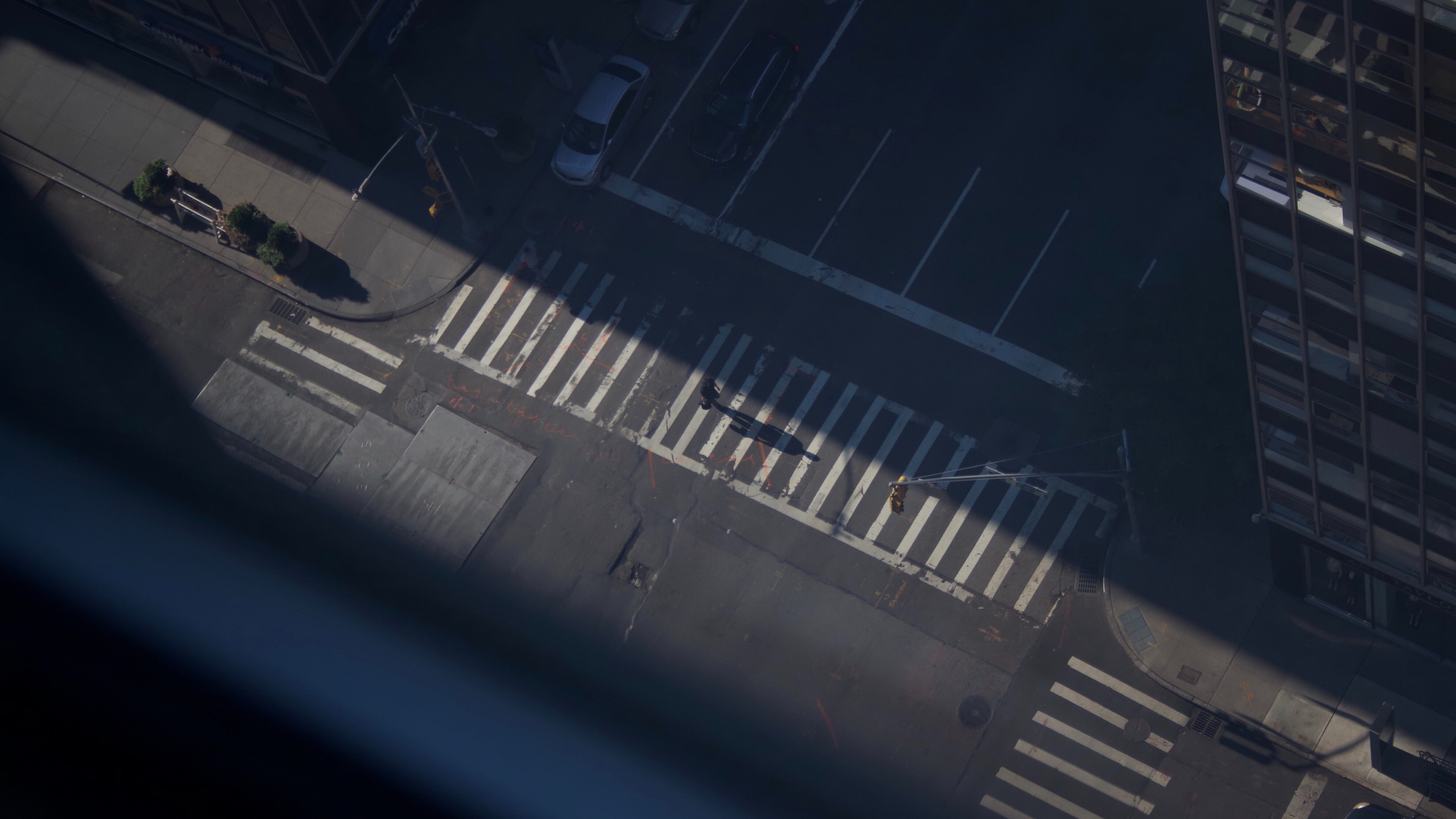 An aerial view of a crosswalk in an urban setting
