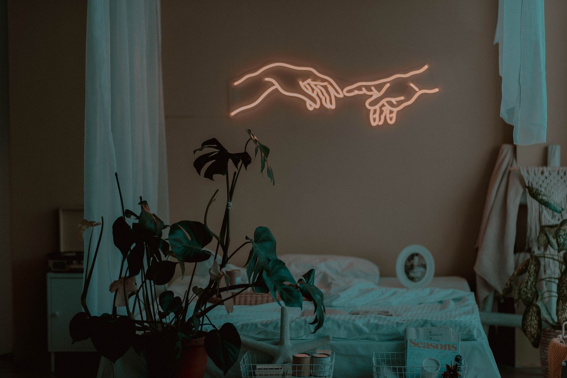 A warm-glowing neon sign mounted in a cozy home interior.
