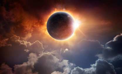Sun fully eclipsed above the clouds, corona ringing the moon