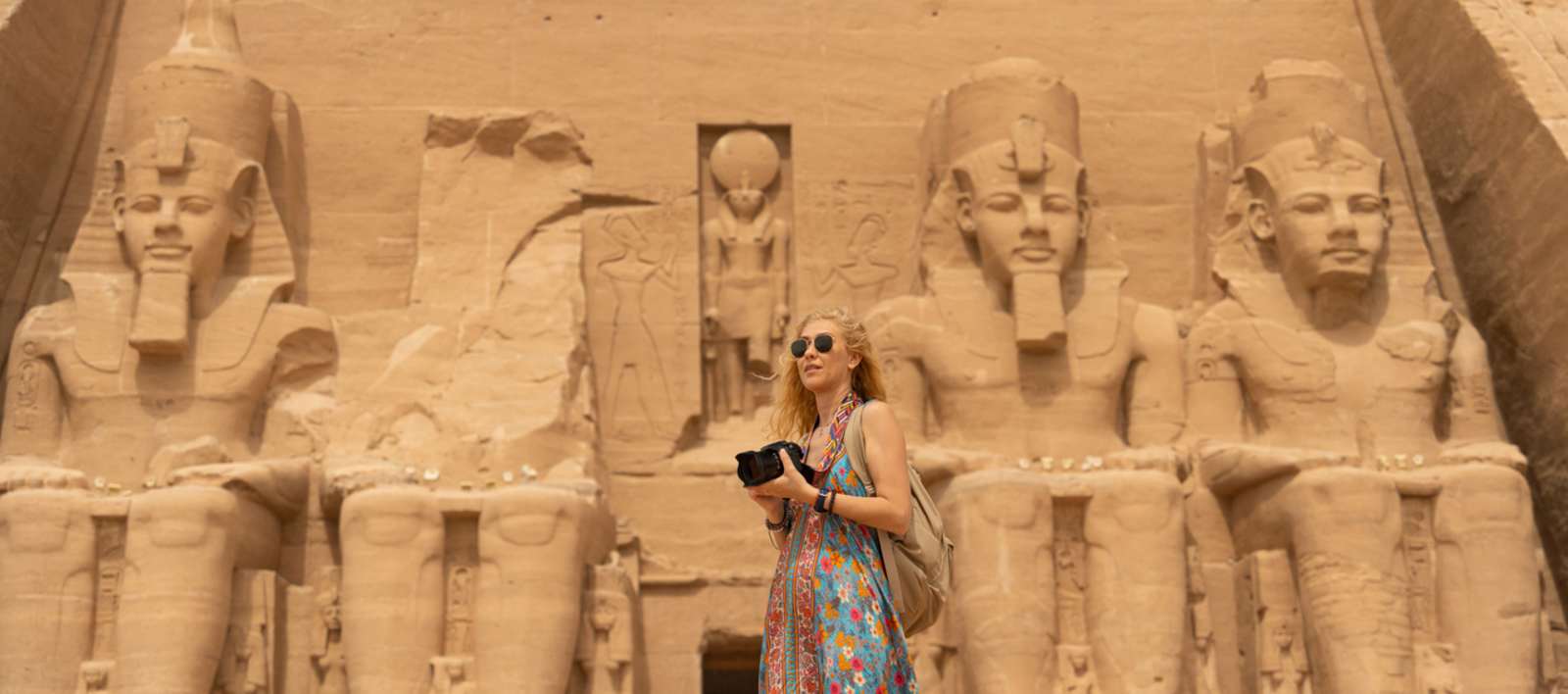 A woman standing in front of Luxor Temple