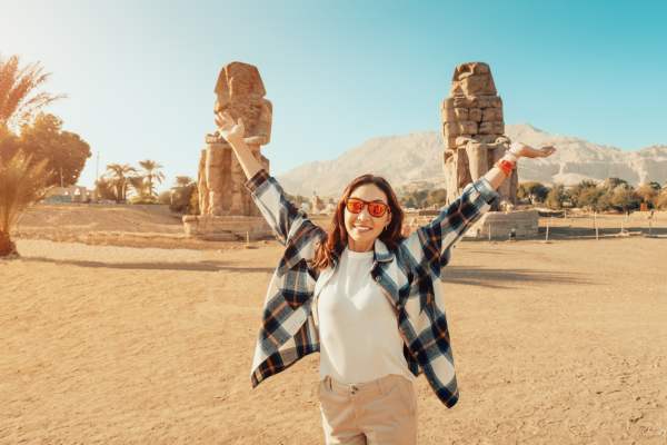 female tourist at colossi of memnon, Trip to Egypt