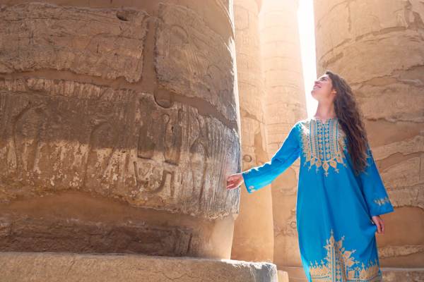 a female tourist wearing traditional egyptian dress in the temples of upper egypt, 8-Day Egypt Itinerary — Cairo, White Desert National Park & Luxor