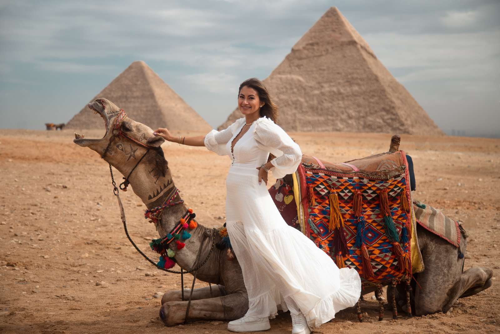 a woman with camel in front of the pyramids, Cairo and Nile Cruise Package: 9 Days from the Pyramids to the Valley of the Kings