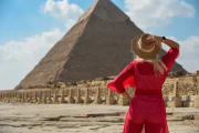 a woman wearing red dress in front of the great pyramid, Egypt Budget Tour