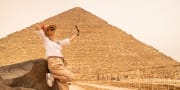 a woman takes selfie in front of the great pyramid, Port Said to Cairo