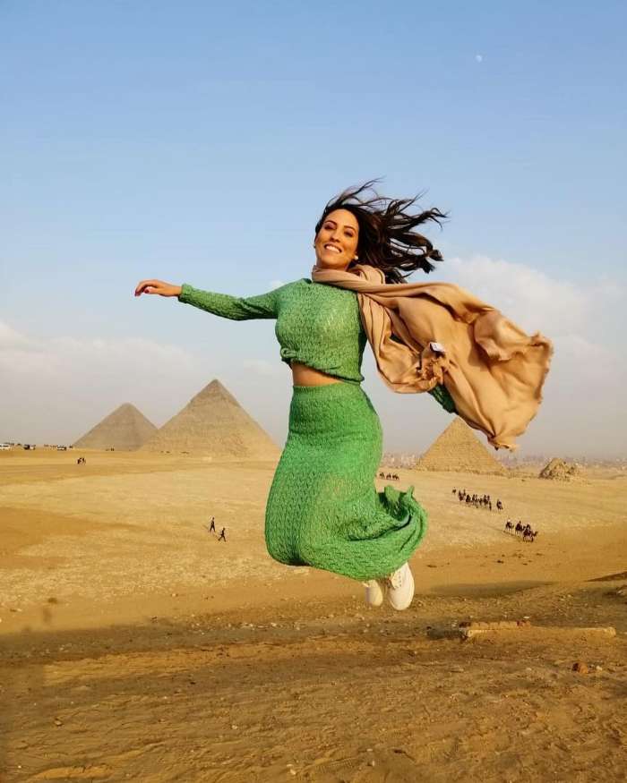 woman jumping infront of the pyramids, Cairo Tour