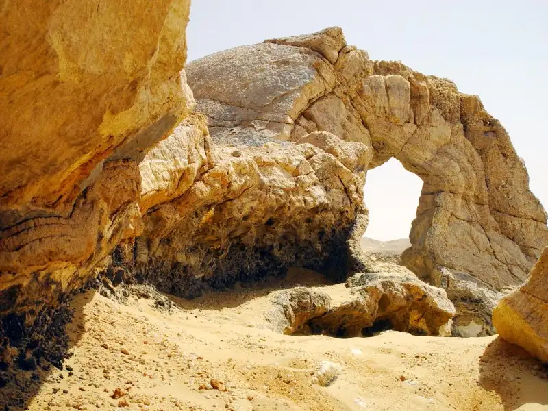 Crystal Mountain arch glowing in the Western Desert sun