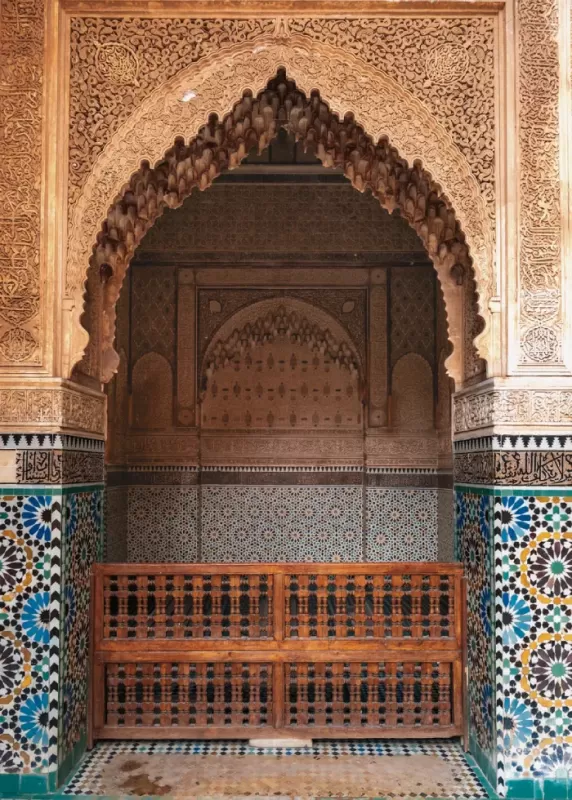 Typoical Moroccan architecture with Zeliij mosaics and carved cedarwood arch in the Saadian Tombs in Marrakesh
