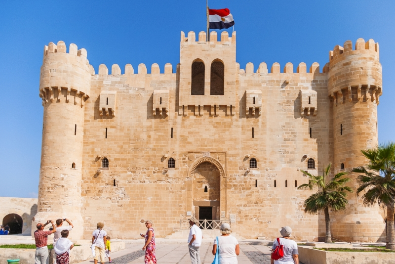Tourist in citadel of Qaitbay fortress and its main entrance yard, 