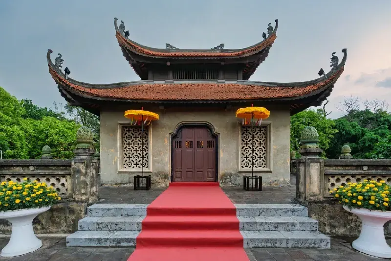  Hanoi's North Gate with traditional architecture and colorful flowers.