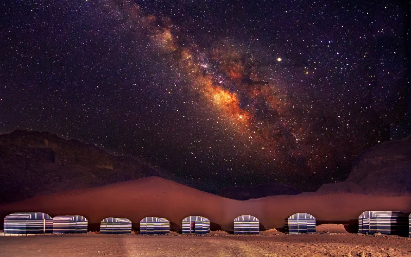 A camp in Wadi Rum desert at night with milky way, Jordan.