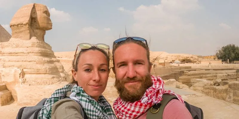 couple taking selfie at the pyramids, Giza Necropolis Egypt
