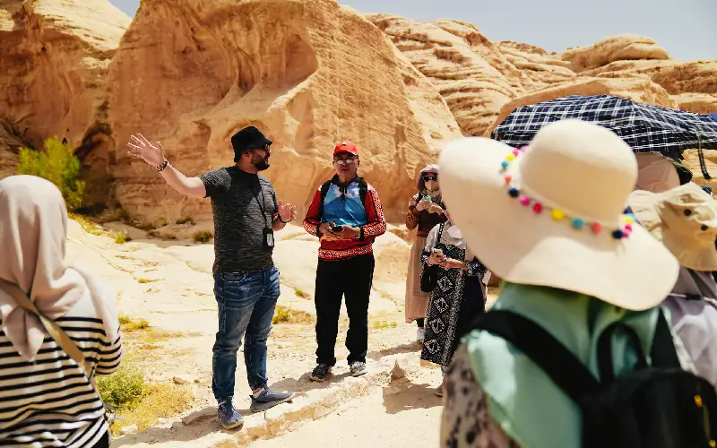 Tour guide explaining Petra city to tour group