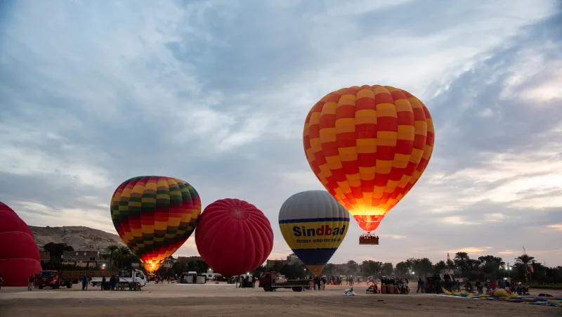 hot air baloon prepared for sunrise flight over ancient sites in Luxor, hot air balloon ride Luxor