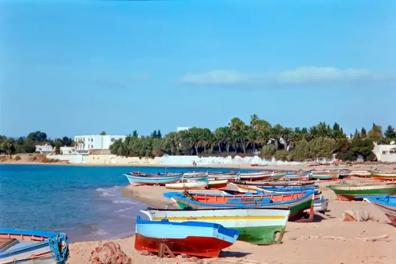 Beach with ltraditional fishing boat. Hammamet, Tunisia