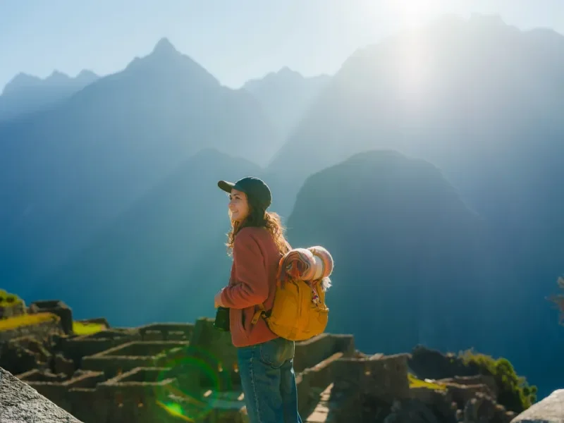 Woman looking at scenic view of Machu Picchu in Peru