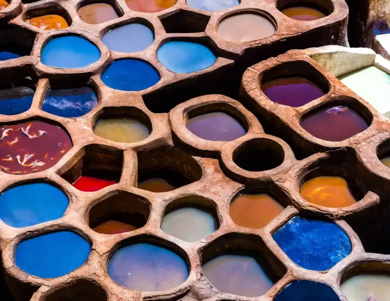 Old tanks of the Fez's tanneries with color paint for leather, Morocco