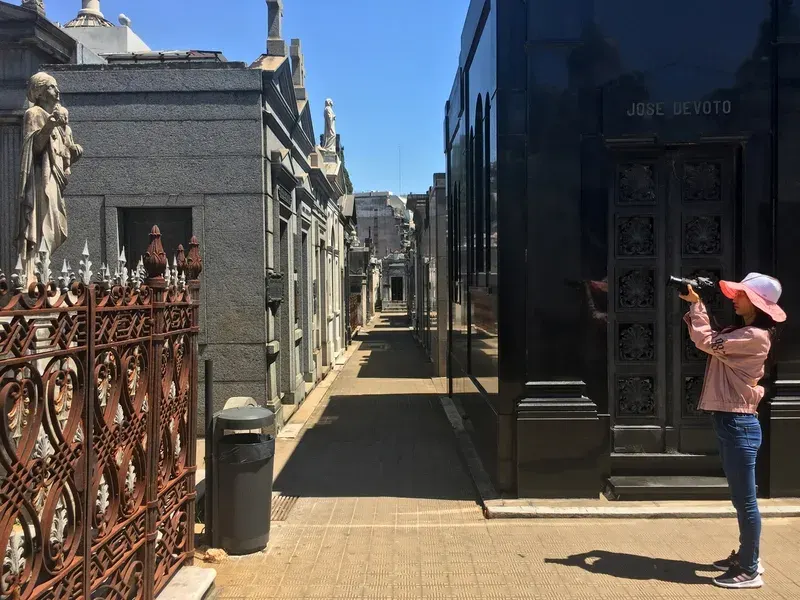 A tourist capture a photo for statue in Recoleta Cemetery stock