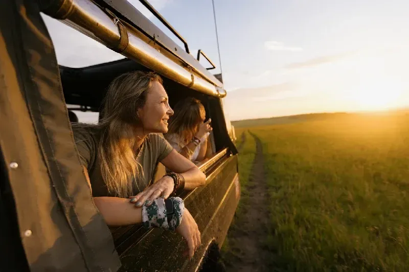 Tourist enjoying her safari trip in Masai Mara