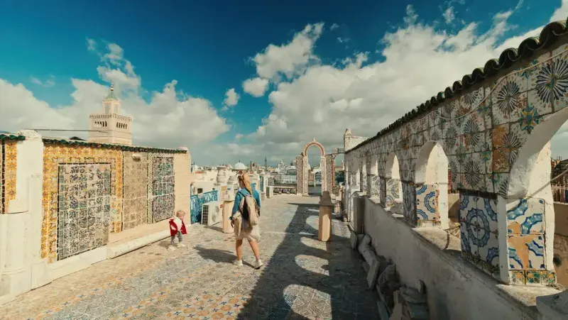Caucasian Mother and Boy Exploring Rooftop in Historic Tunis