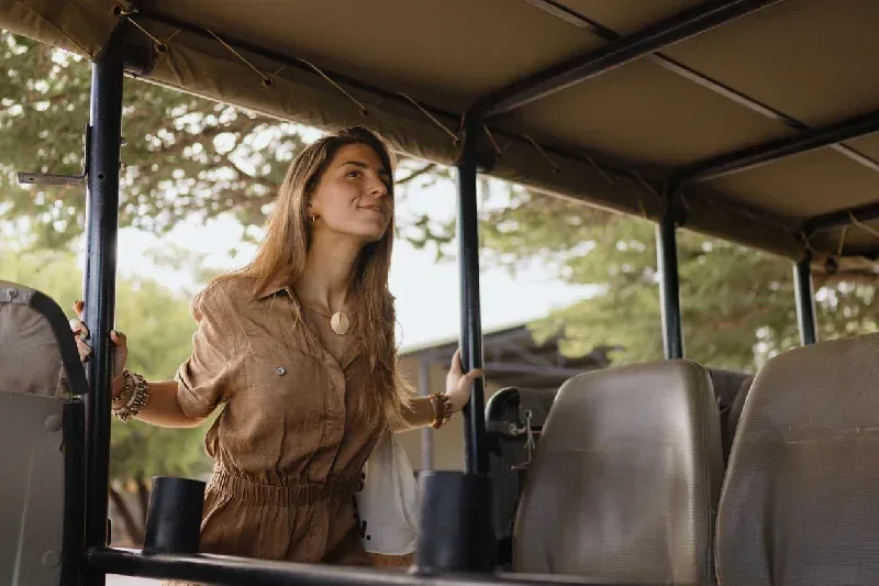 Young woman enjoying a safari game drive