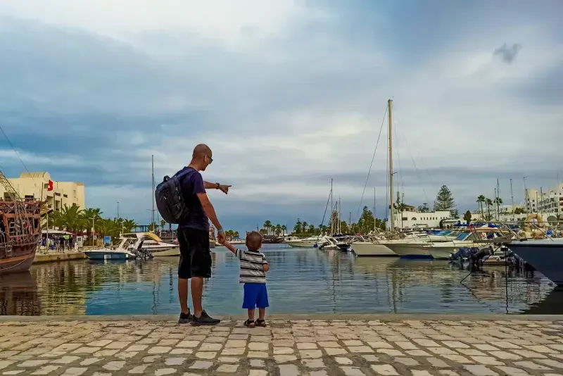 A father and his son are happy and enjoying a tour of Port El Kantaoui in Sousse, Tunisia