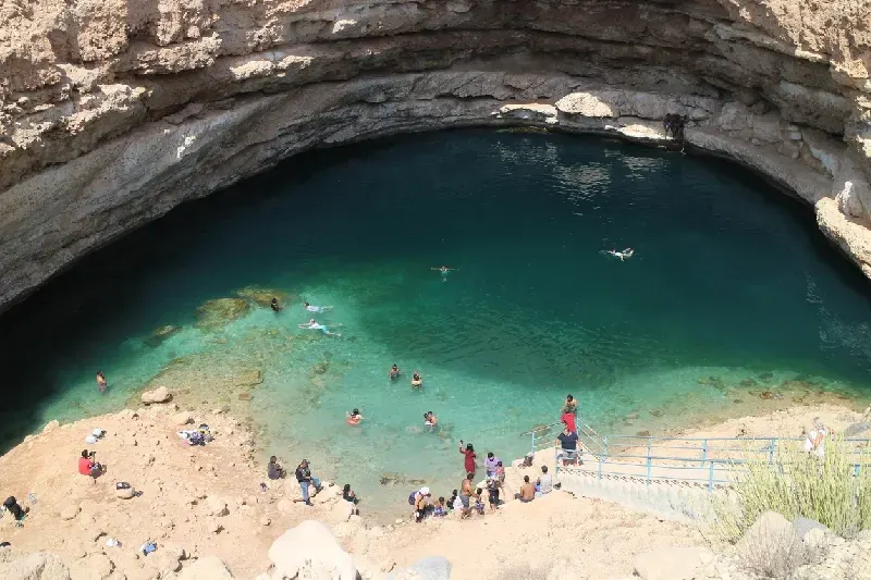 Visitors swimming in Bimmah Sinkhole