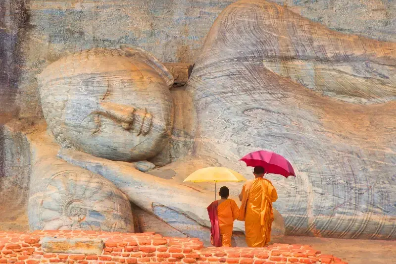 Father and son praying in Buddha Gal Vihara temple