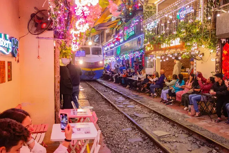 Train passing through the iconic narrow Hanoi Train Street