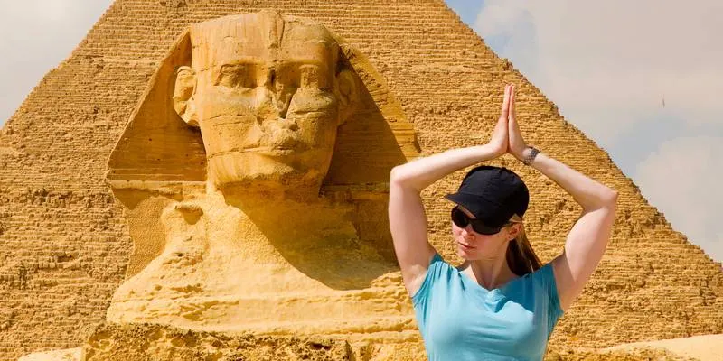 sphinx with a female tourist, Giza Necropolis Egypt