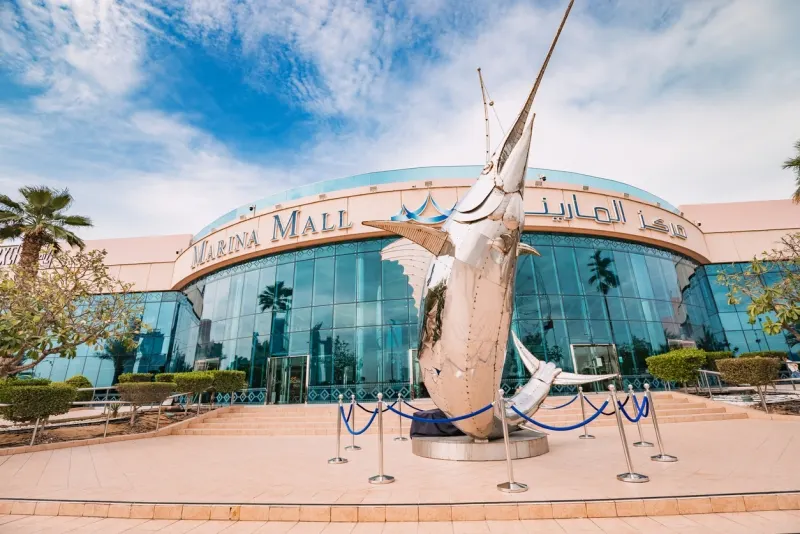 Marina mall entrance with steel swordfish sculpture