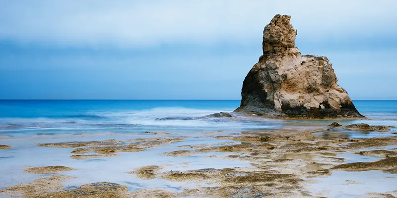 Cleopatra's Beach near Marsa Matrouh, Egypt, showcasing its famous rock formations under daylight.