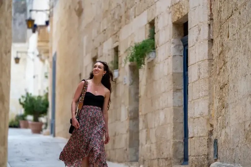 Woman explores old town streets, Rabat