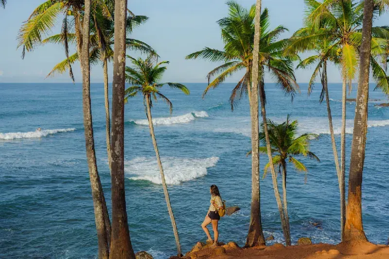 Woman admiring the ocean in Mirissa.