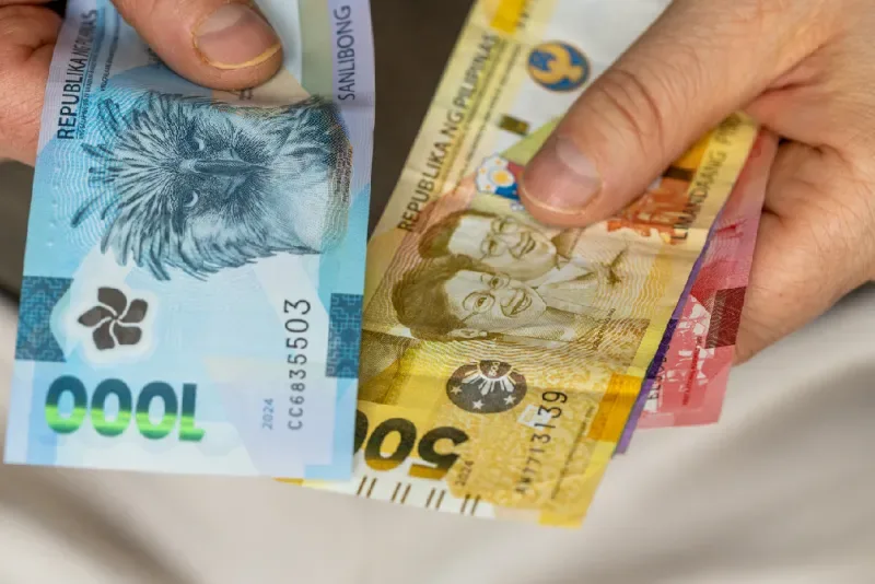 Philippine peso bills in different denominations, the official currency of the Philippines for tourists and local transactions.