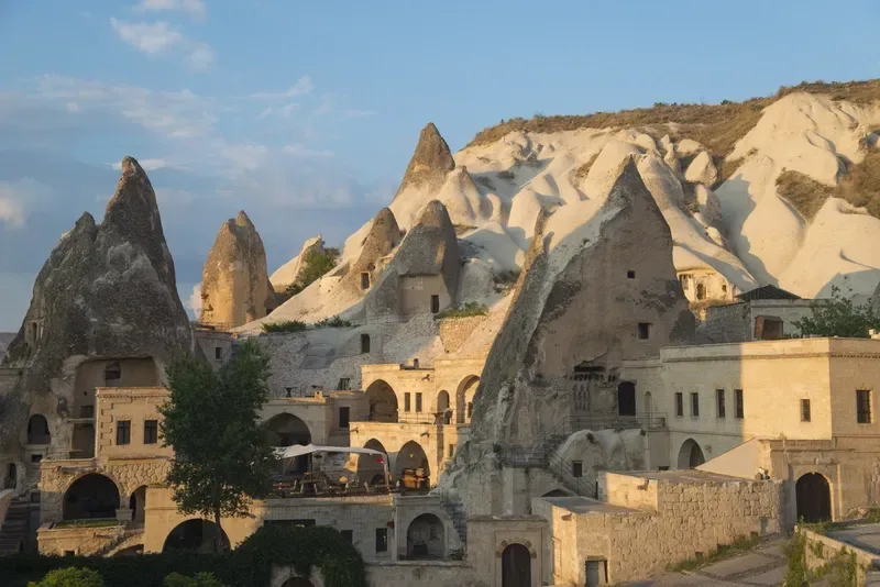 Dwellings in rocks of Cappadocia. Blue sky in background