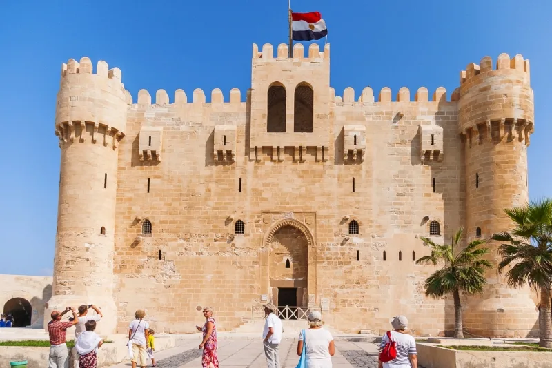 Tourist in citadel of Qaitbay fortress and its main entrance yard, 