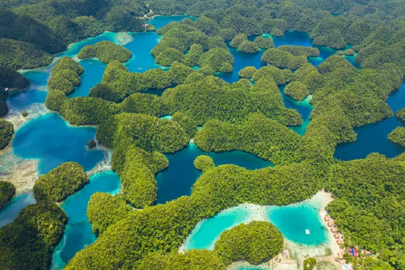 Aerial view of turquoise lagoons and lush green islands in the Philippines
