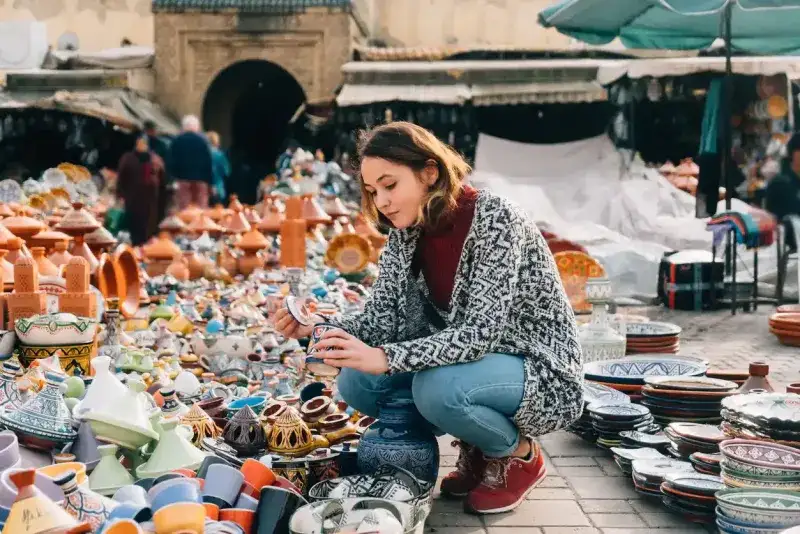 Woman choosing Ceramic in shop in Meknes, Morocco