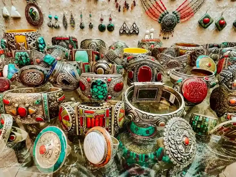 a-selection-of-traditional-jewelry-and-ceramics-displayed-at-a-souk-vendor-in-tangier-morocco
