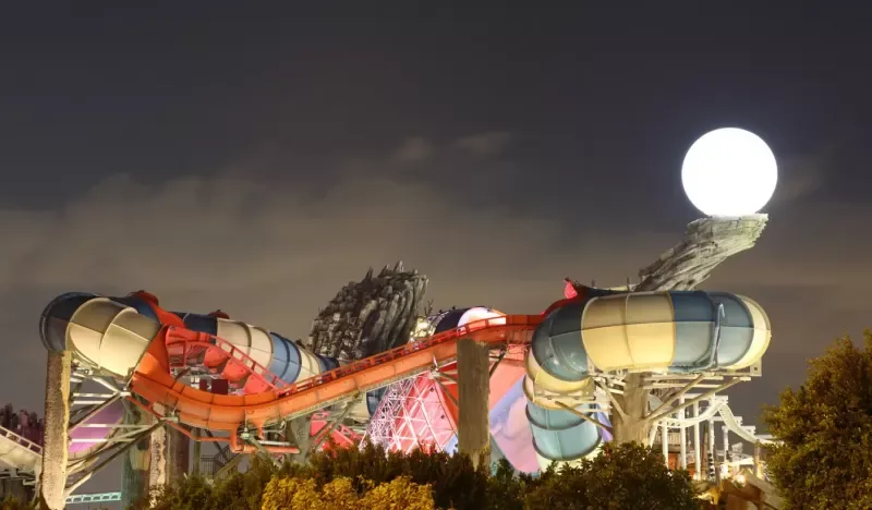 Yas Waterworld amusement park in Abu Dhabi illuminated at night