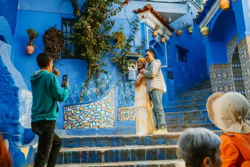 Couple Posing in Chefchaouen's Iconic Blue Streets 