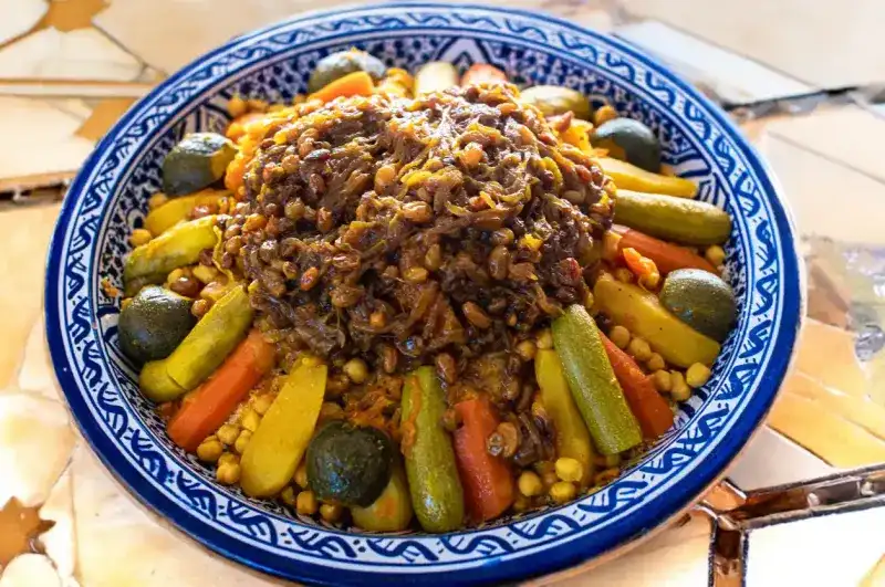 Couscous dishes and its assortment of vegetables. 