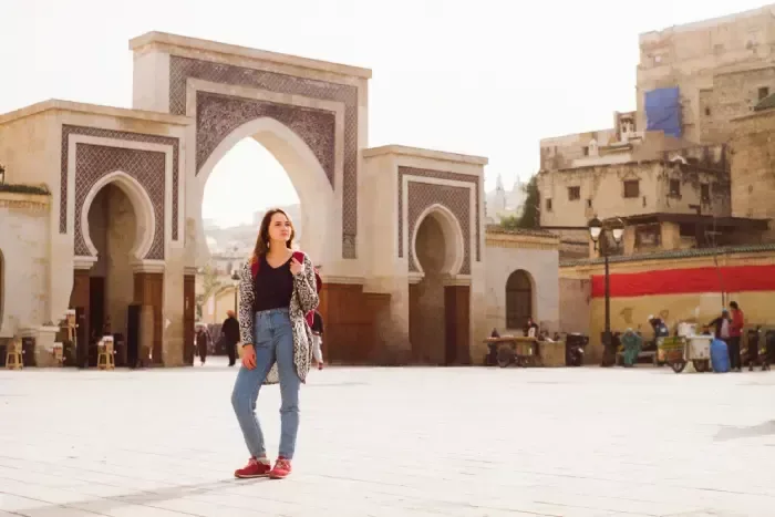 Woman standing near the Bab Boujeloud in Fez