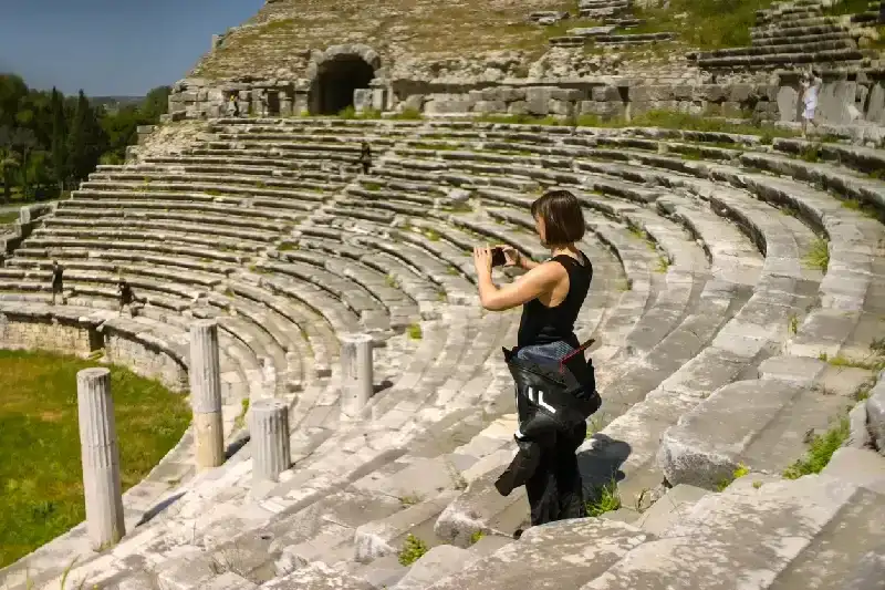 Woman on Miletus amphitheater steps.