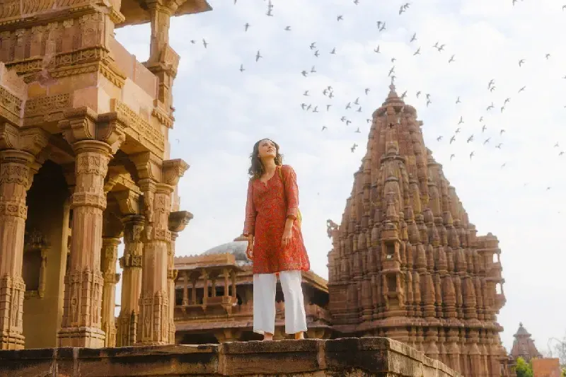 Serene woman exploring Rajasthani architecture in January