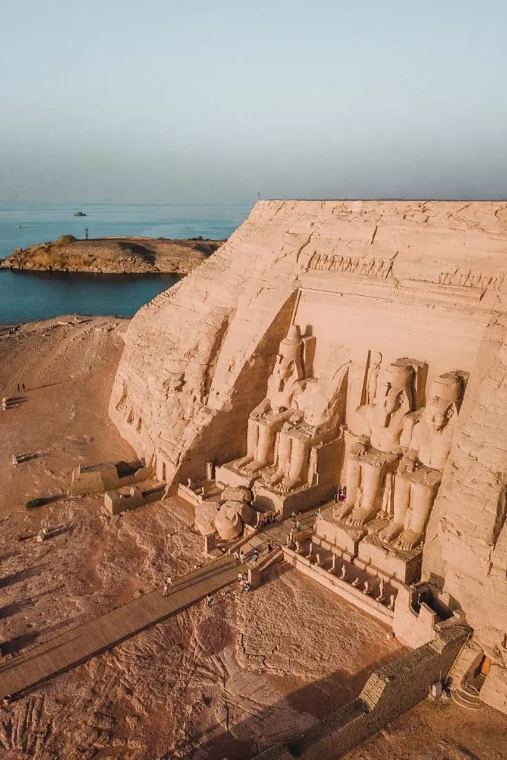 Drone view of Abu Simbel Temple in Egypt with colossal seated statues overlooking Lake Nasser